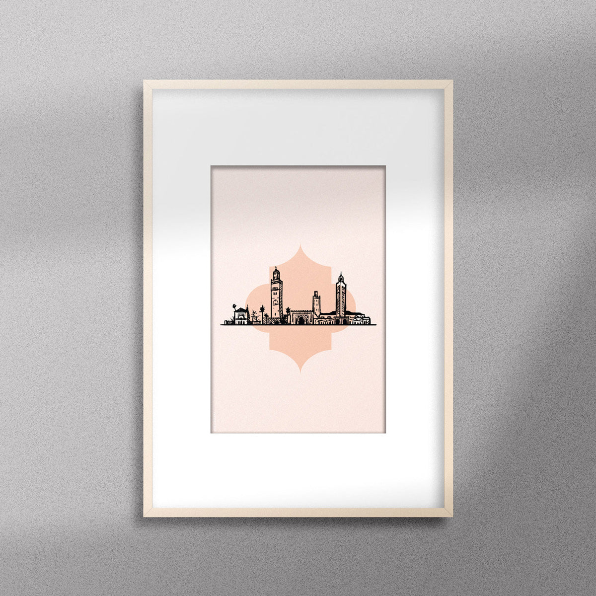 Tableau décoratif illustrant monuments emblématiques du Maroc sur un fond rose pale, encadré dans un cadre en bois - Format A4.