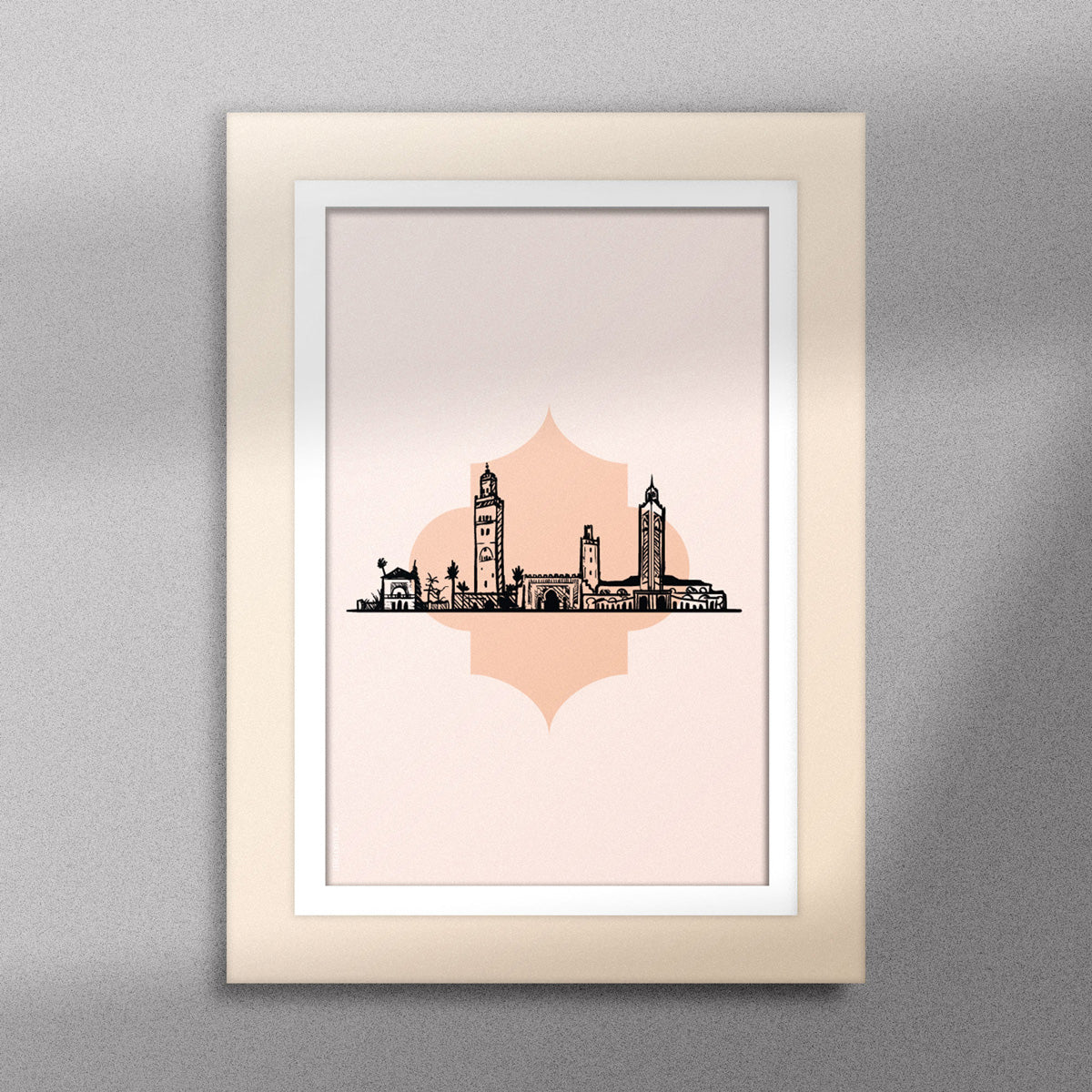 Tableau décoratif illustrant monuments emblématiques du Maroc sur un fond rose pale, encadré dans un cadre en bois - Format A5.